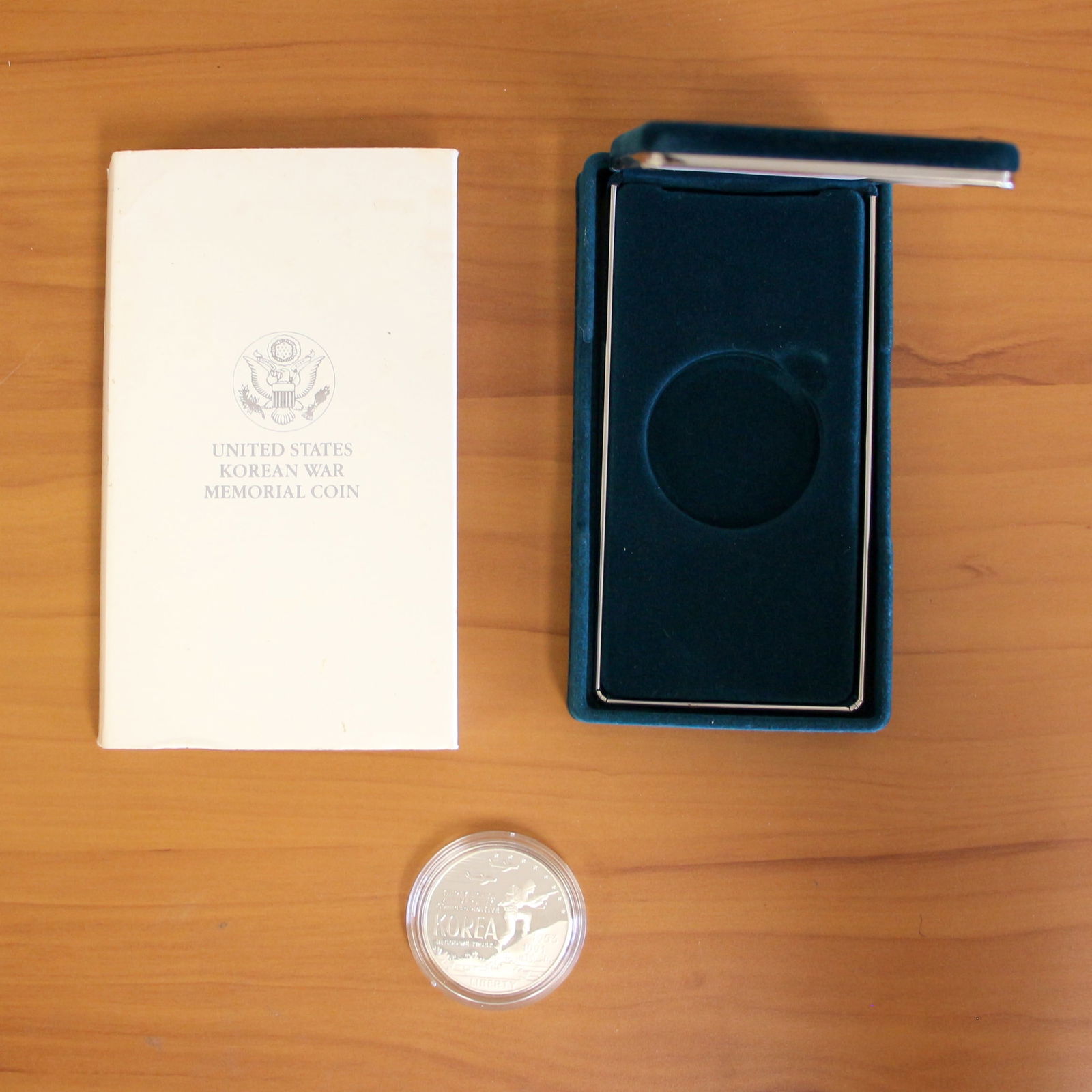 US Mint 38th Anniversary Korean War Memorial Silver Coin OGP: Contains one 38th Anniversary Korean War $1 Silver Memorial Coin. Includes original packaging.