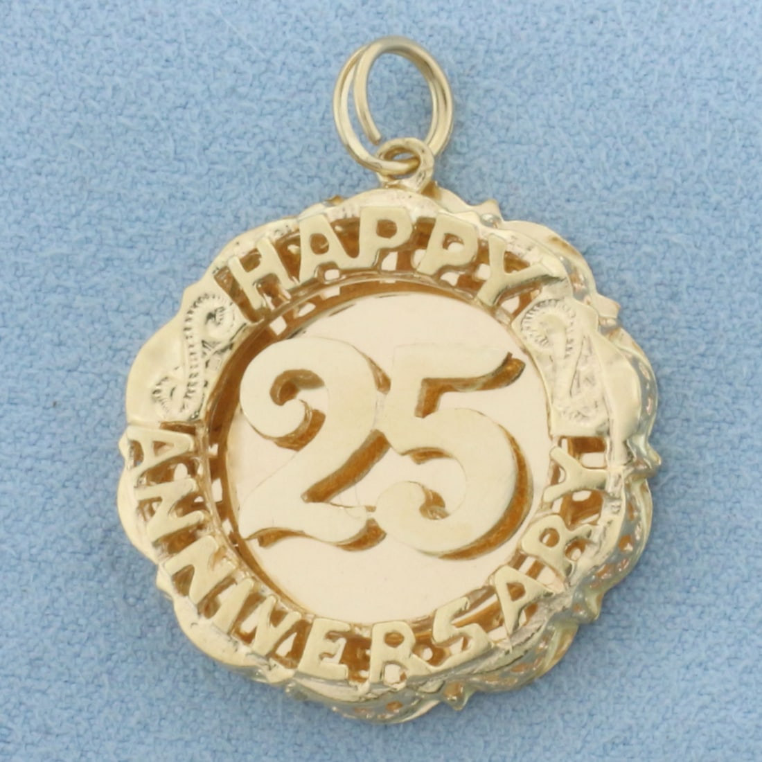 Engravable Happy 25 Anniversary Charm in 14k Yellow Gold: In 14k Yellow Gold. 1 1/4 inch long (including jump ring). 1 inch wide. Blank back to engrave names or dates. 6.1g.