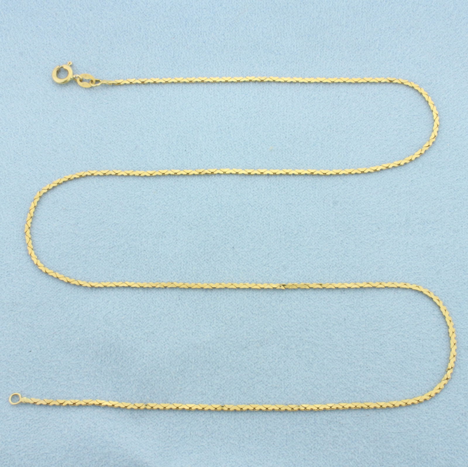 16 Inch Italian Heart Link Chain Necklace in 14k Yellow Gold: In 14k Yellow Gold. 16 inches long. 1.3mm wide. Made in Italy. Spring clasp. 2.3g.