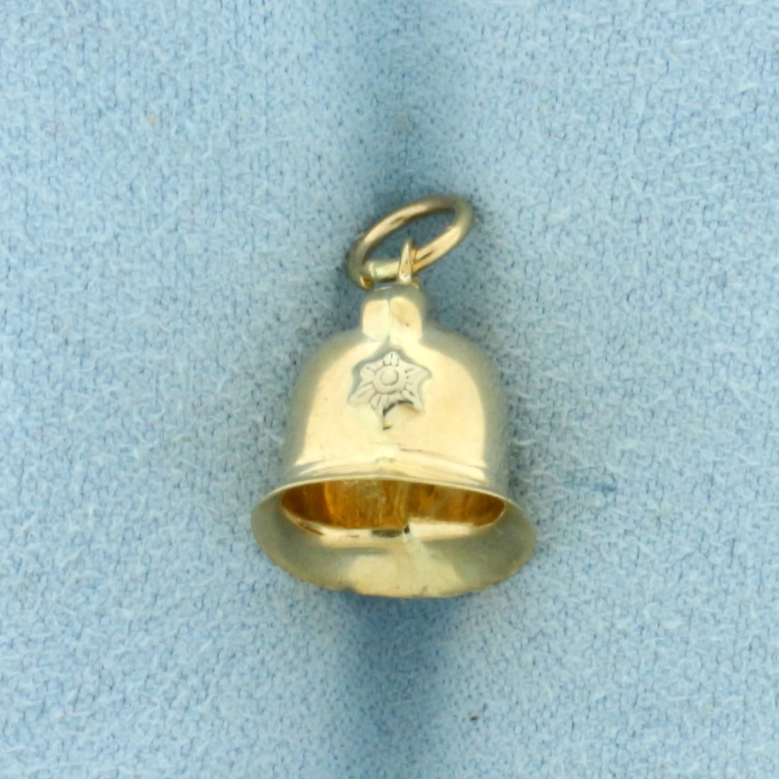 Vintage Police Helmet Charm in 9k Yellow Gold: In 9k Yellow Gold. 5/8 inch long (including jump ring). 1/2 inch wide. 1.1g.