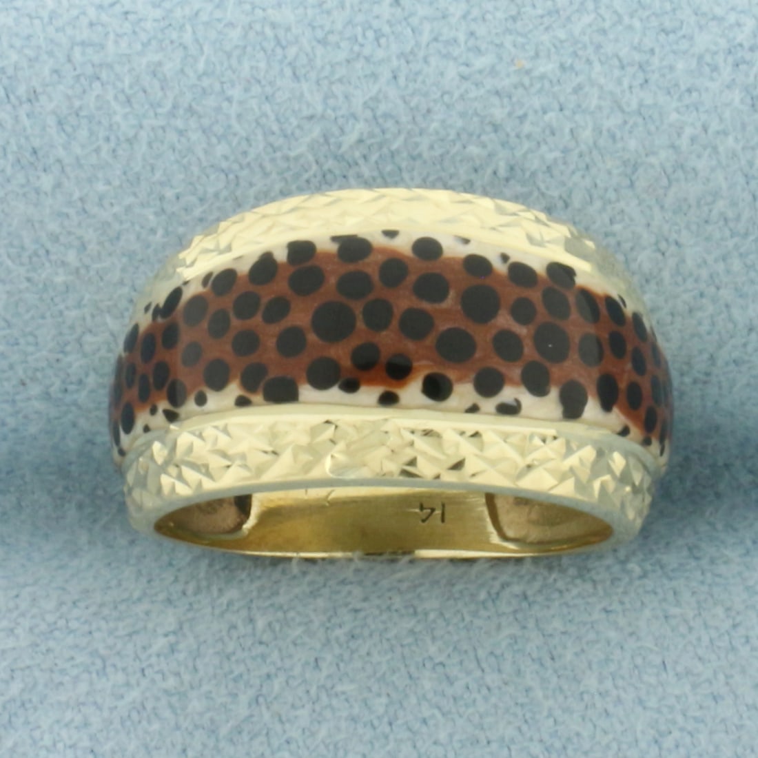 Animal Print Ring in 14k Yellow Gold: In 14k Yellow Gold. 10.3mm wide at widest. Size 5. 2.9g.