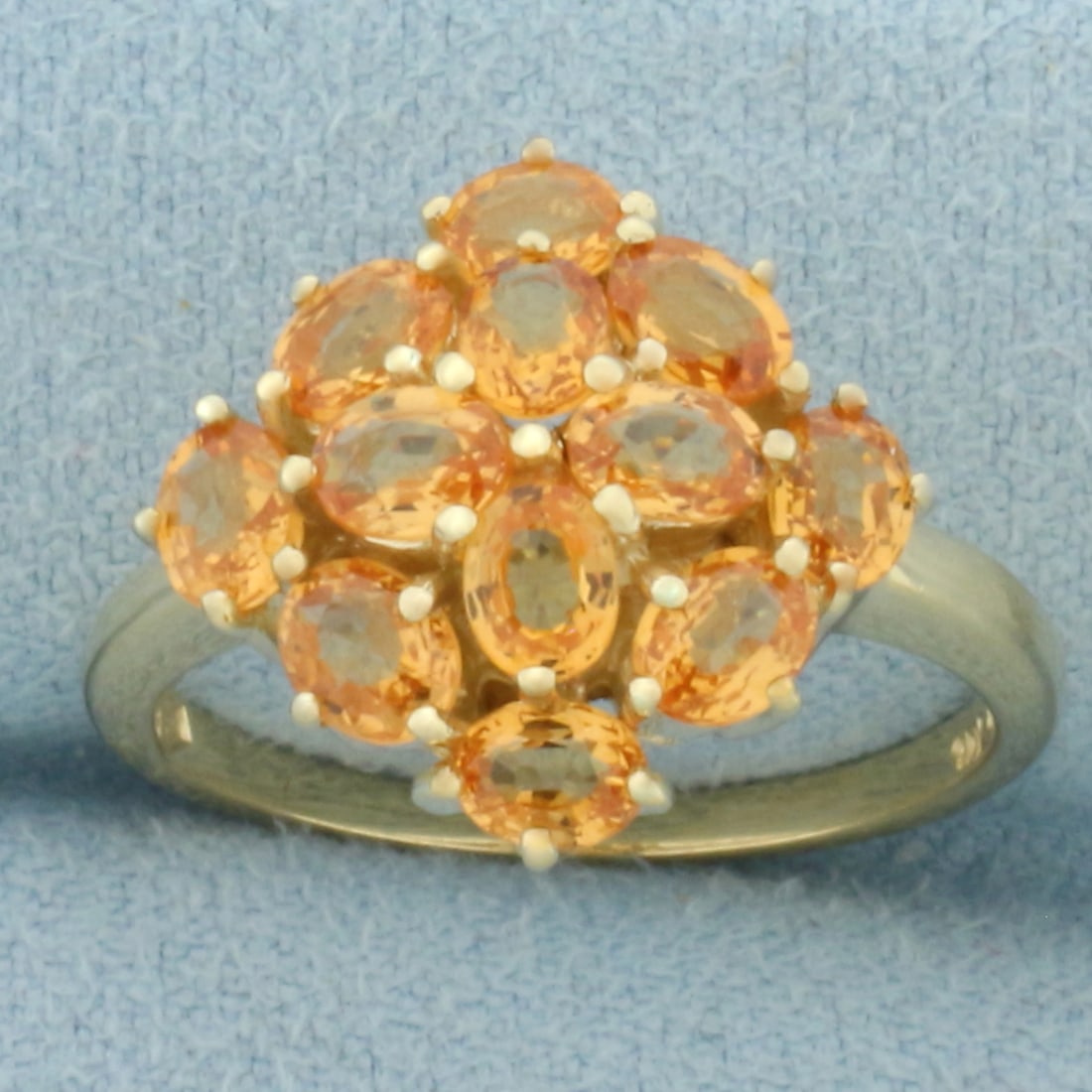 Golden Citrine Ring in 14k Yellow Gold: In 14k Yellow Gold. Contains twelve 4mm high quality oval natural Citrine gemstones with vibrant golden color and excellent clarity. 15mm wide at center top of ring. Size 7.25. 3.7g.