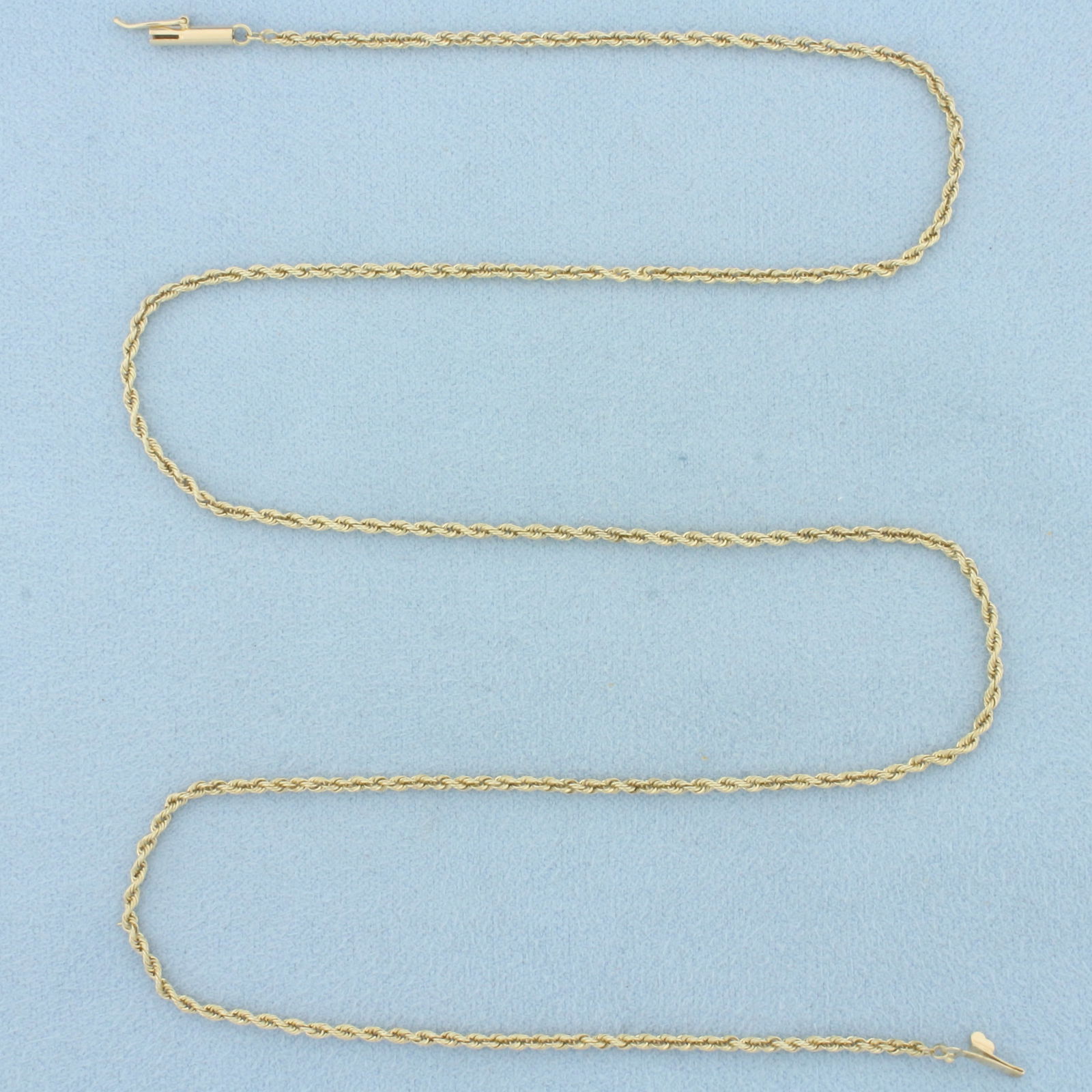 20 Inch Rope Link Chain Necklace in 14k Yellow Gold: In 14k Yellow Gold. 20 inches long. 1.7mm wide. Barrel clasp with safety latch. 4.9g.