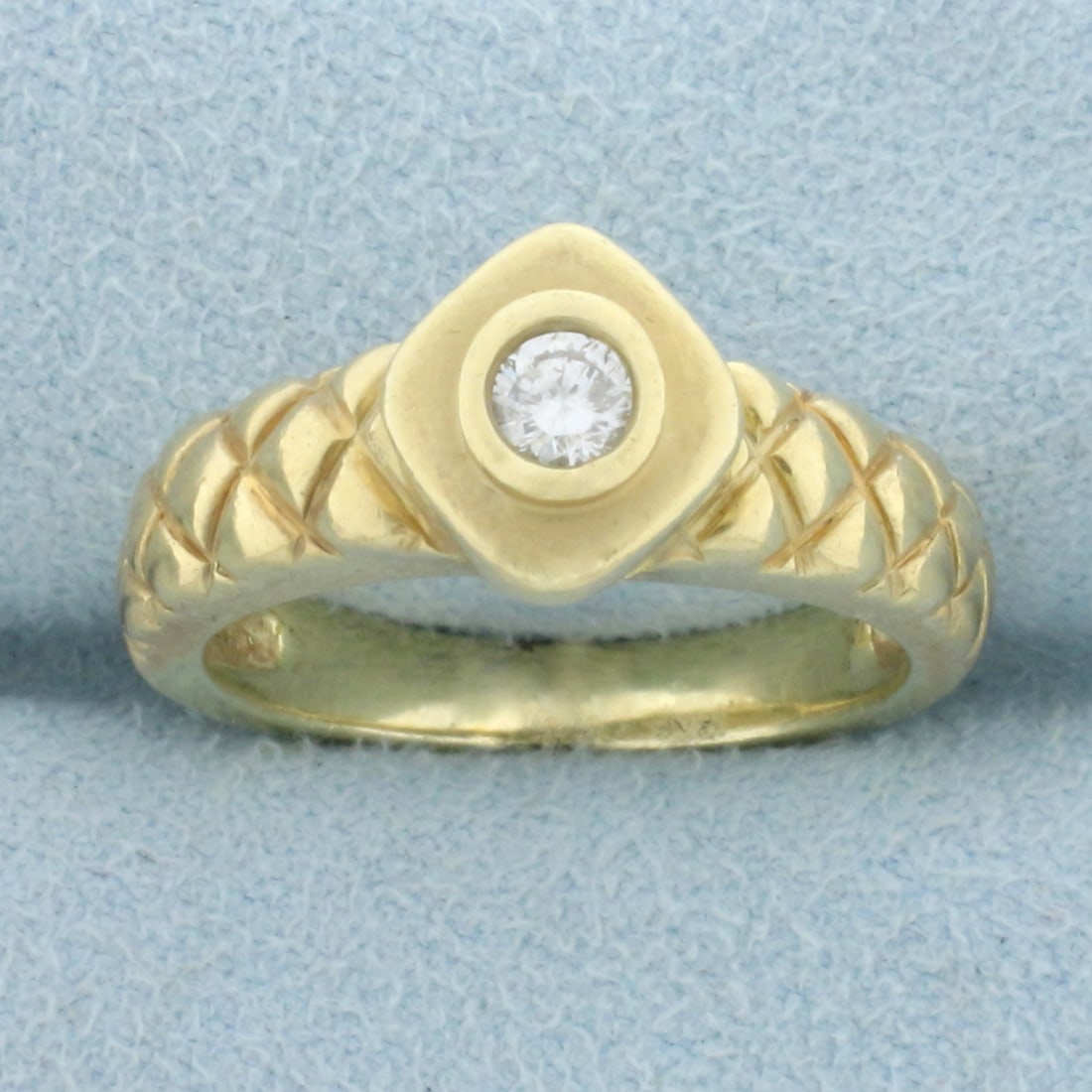 Unique Quilted Design Diamond Solitaire Ring in 14K Yellow Gold: In 14K Yellow Gold. Contains one high quality 1/5ct round brilliant cut Diamond, SI1 clarity/H color. Size 6 3/4. 7.1g.