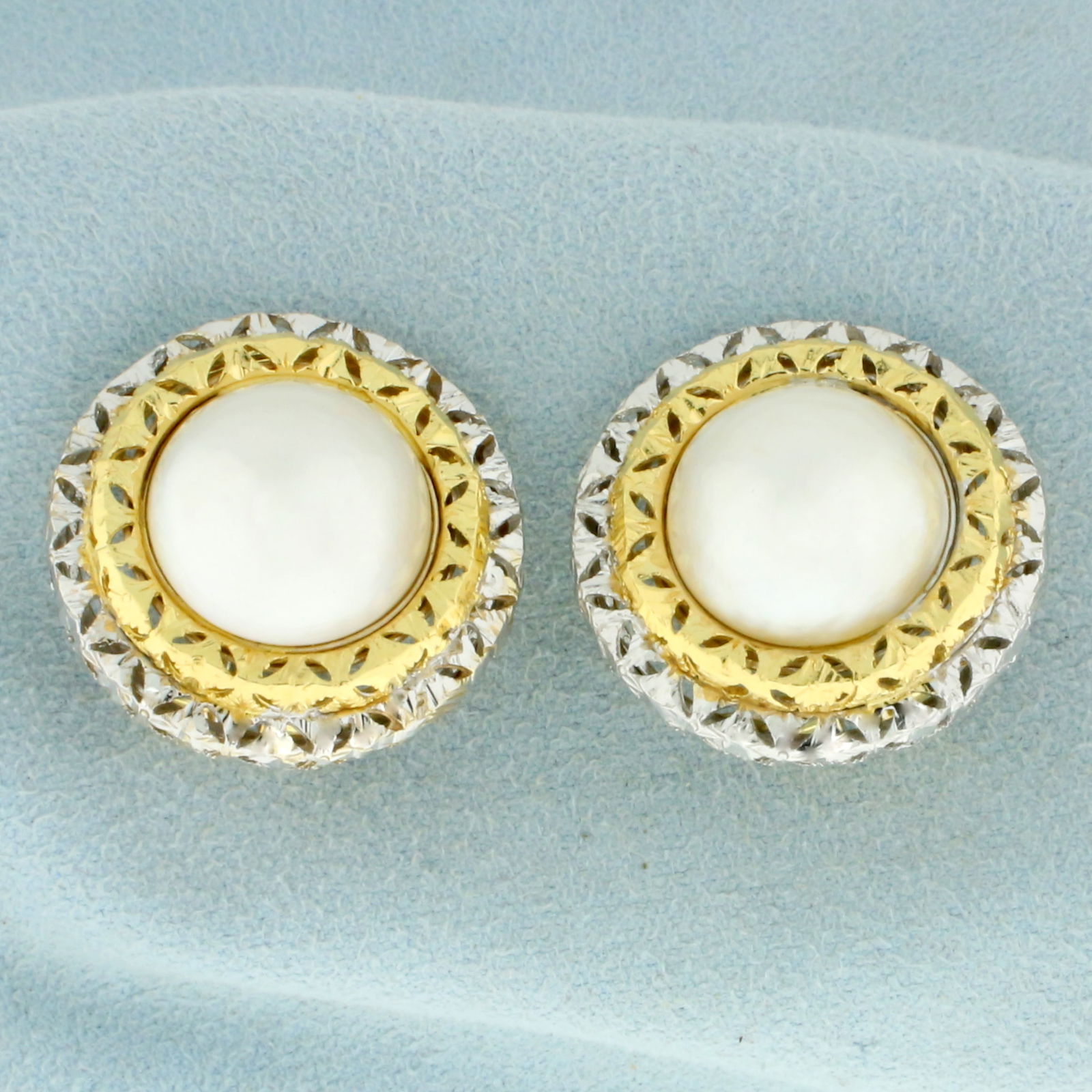 Vintage Mabe Pearl Clip on Statement Earrings in 18K Yellow and White Gold: In 18K Yellow and White Gold. Each earring contains one high quality natural 13.2mm Mabe Pearl with high luster and iridescent overtones. 1 inch long and wide. Clip on backs for non pierced ears. 19.6