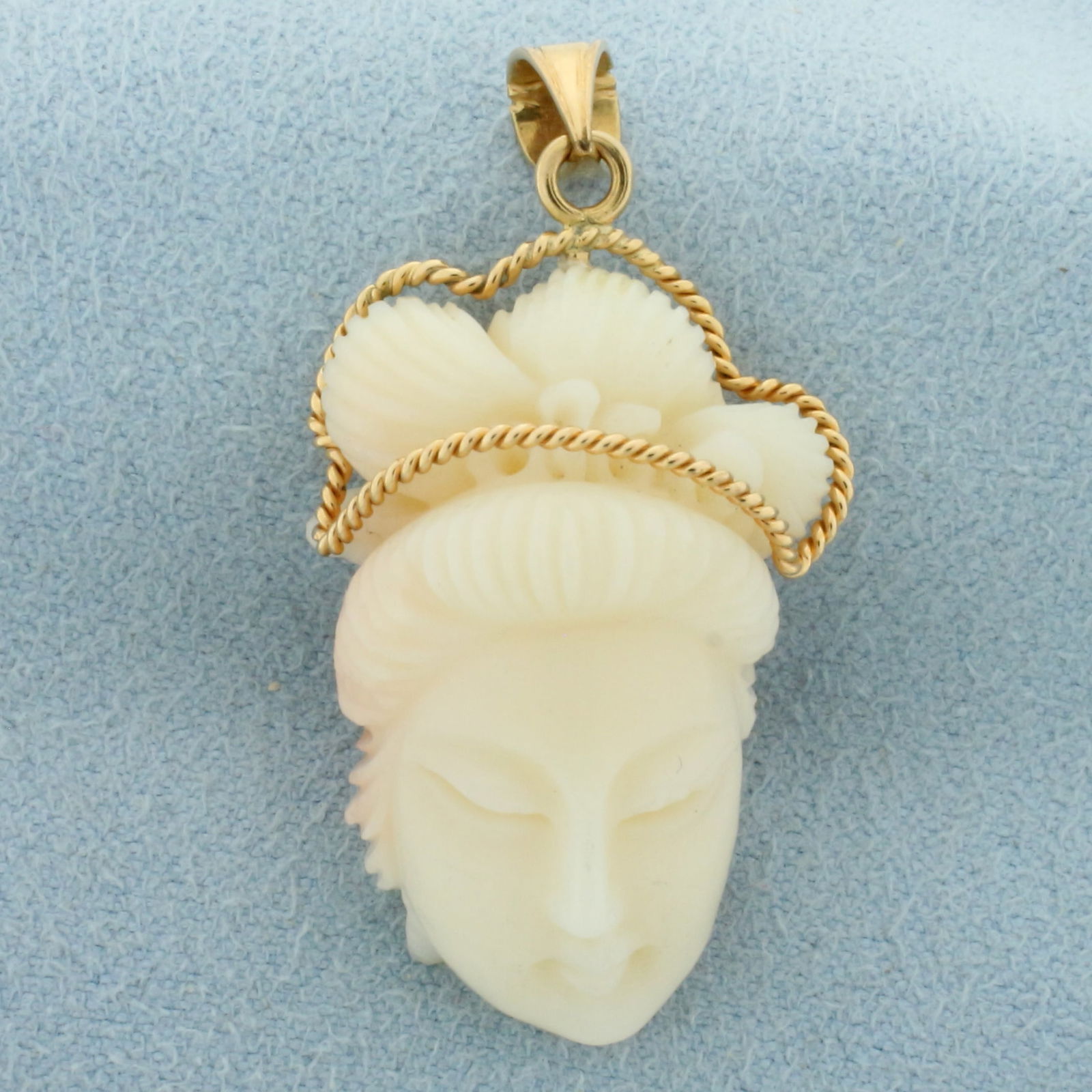 Vintage Hand Carved Angel Skin Coral Asian Women Pendant in 14k Yellow Gold: In 14k yellow gold. 1.5 inches long (including bale) x 3/4 inches wide. 7.9g.