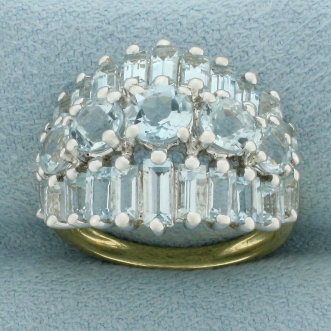 Aquamarine 3 Row Statement Ring in 14k Yellow Gold: In 14k yellow gold. Contains 5 round and 22 baguette high quality natural Aquamarine gemstones, 3ct TW, with bright color and excellent clarity. Size: 6. 5.8g.