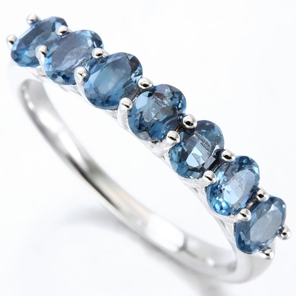 London Blue Topaz Stacking Band Ring in Sterling Silver: In platinum over .925 sterling silver. Contains 7 London blue topaz gemstones, 1.3ctw. Size 7. 2.4g