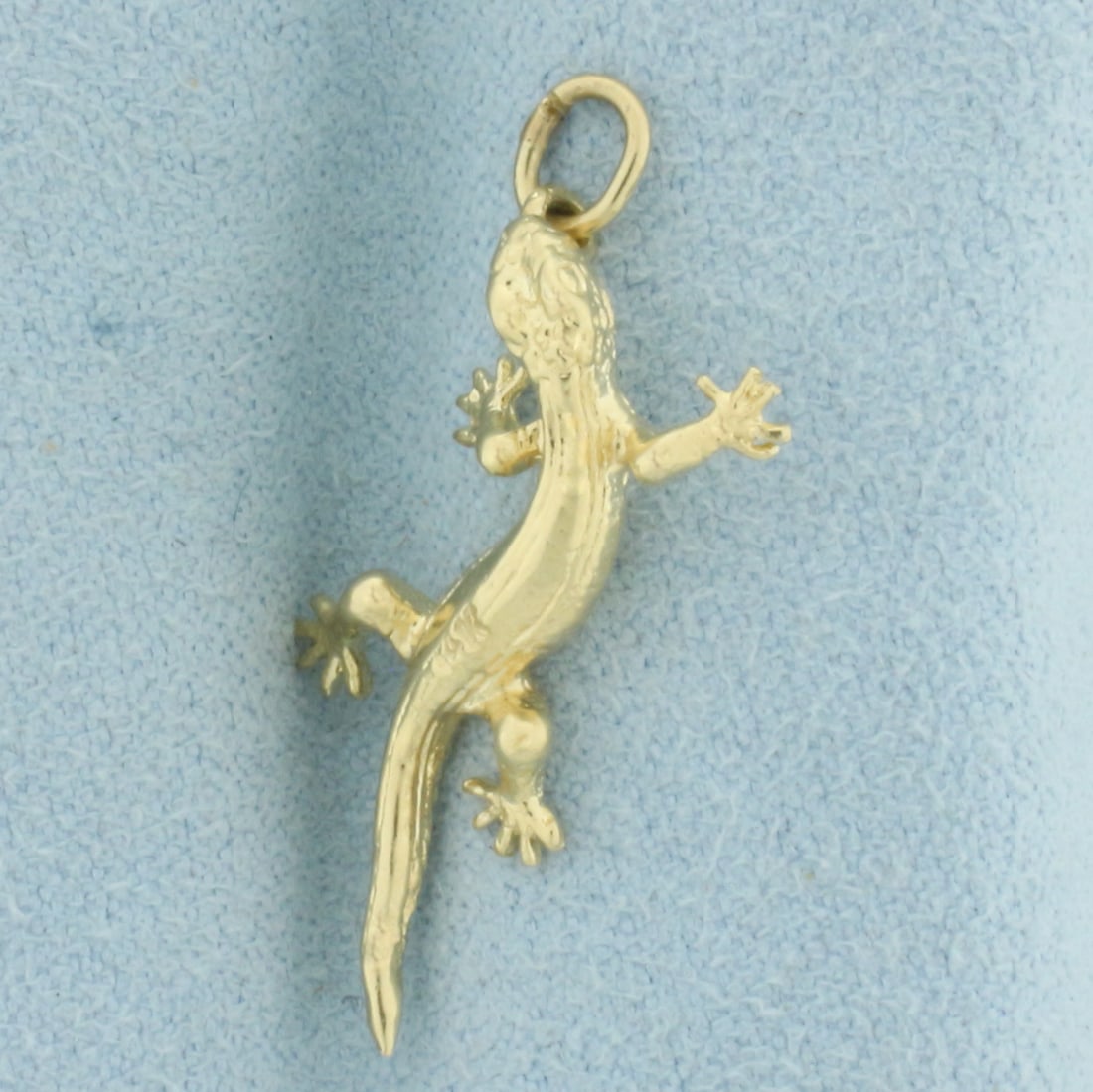 Gecko Charm or Pendant in 14k Yellow Gold: In 14k Yellow Gold. 1 inch long. 3/8 inch wide at widest. 2.0g.