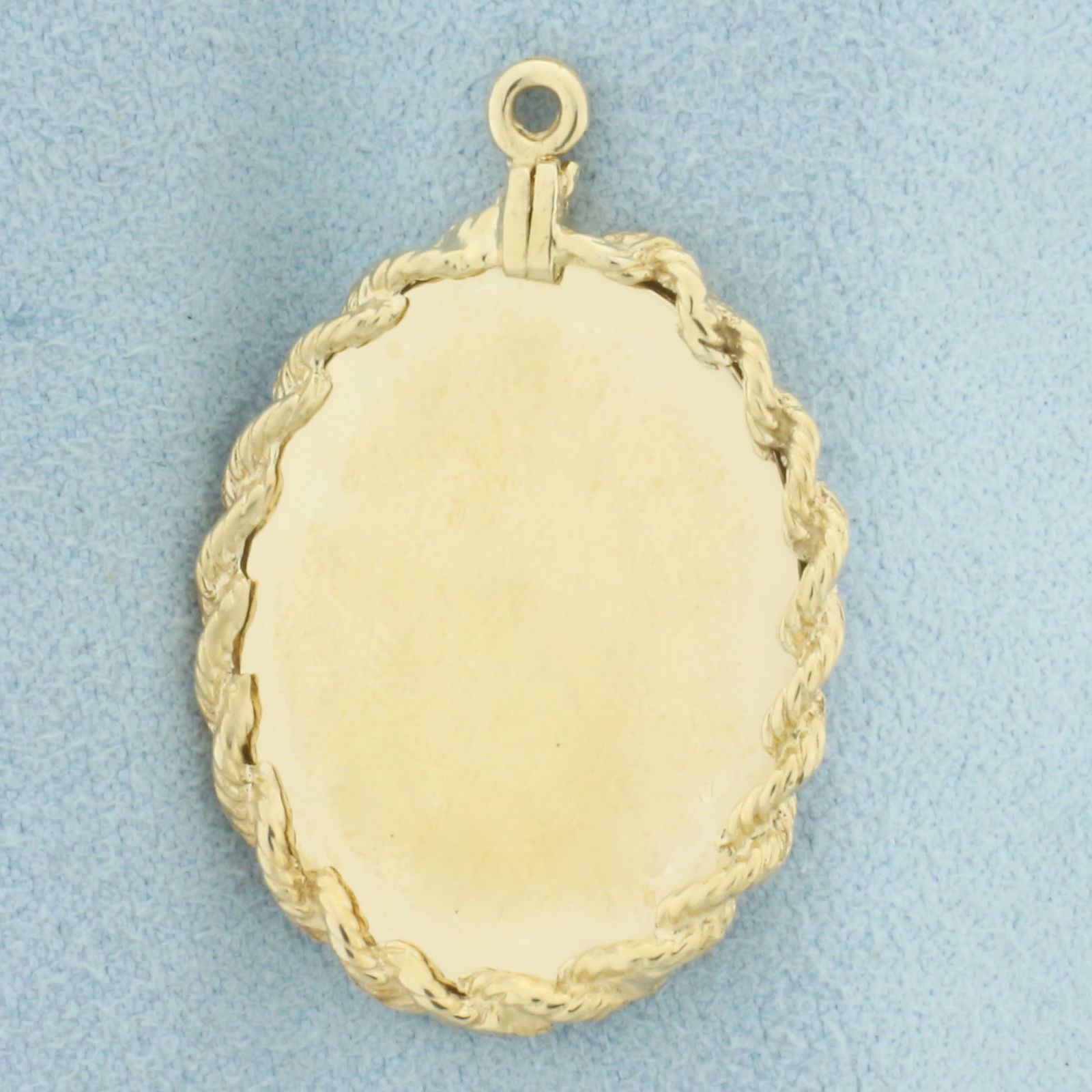 Engravable Oval Pendant or Charm in 14k Yellow Gold: In 14k Yellow Gold. 1 1/4 inch long. 7/8 inch wide. Can engrave name or date on either side. 3.9g.