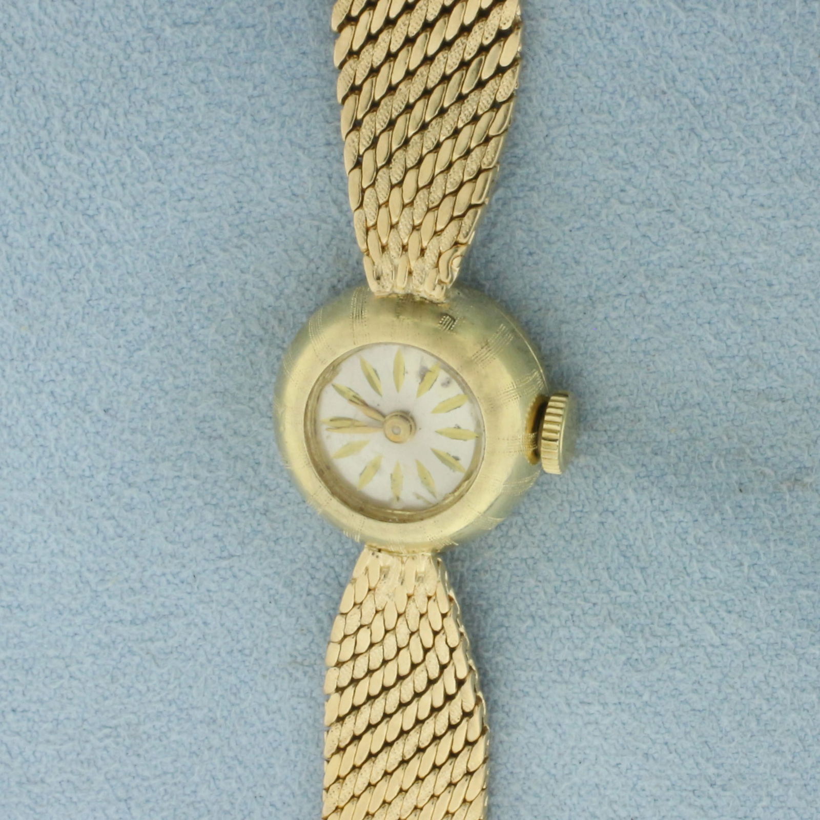 Antique Eloga Swiss Wind Up Ladies Dress Watch in Solid 14k Yellow Gold Case and Bracelet: Case and Bracelet in 14k Yellow Gold. 17 Jewel Swiss windup movement runs great. 15mm case. Safety chain. 22.7g.