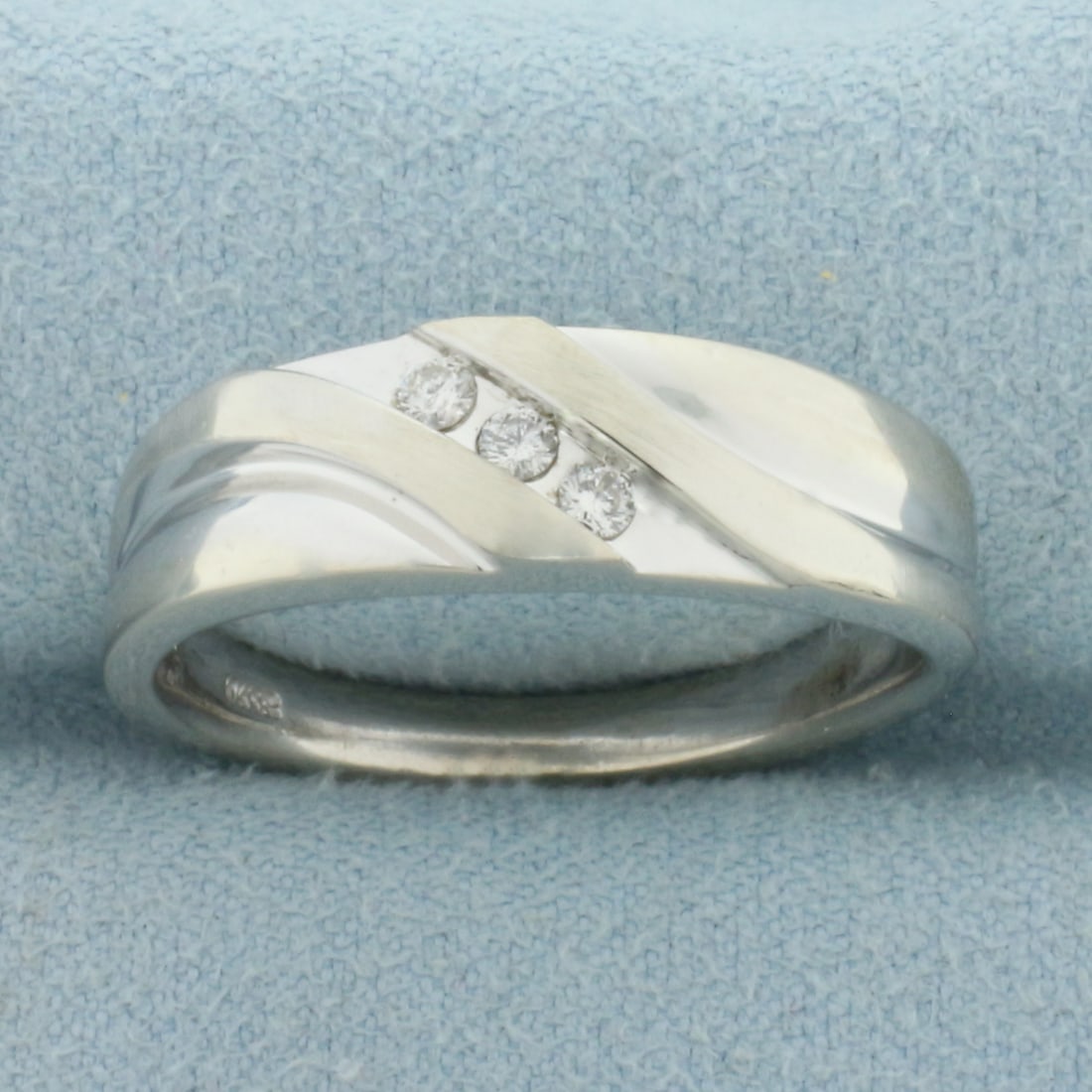 Mens 3 Stone Diagonal Diamond Wedding or Anniversary Band Ring in 10k White Gold: In 10k White Gold. Contains three .03ct high quality diamonds, 1/8ct TW, SI clarity/H color. 7mm wide at center. Size 10. 8.2g.