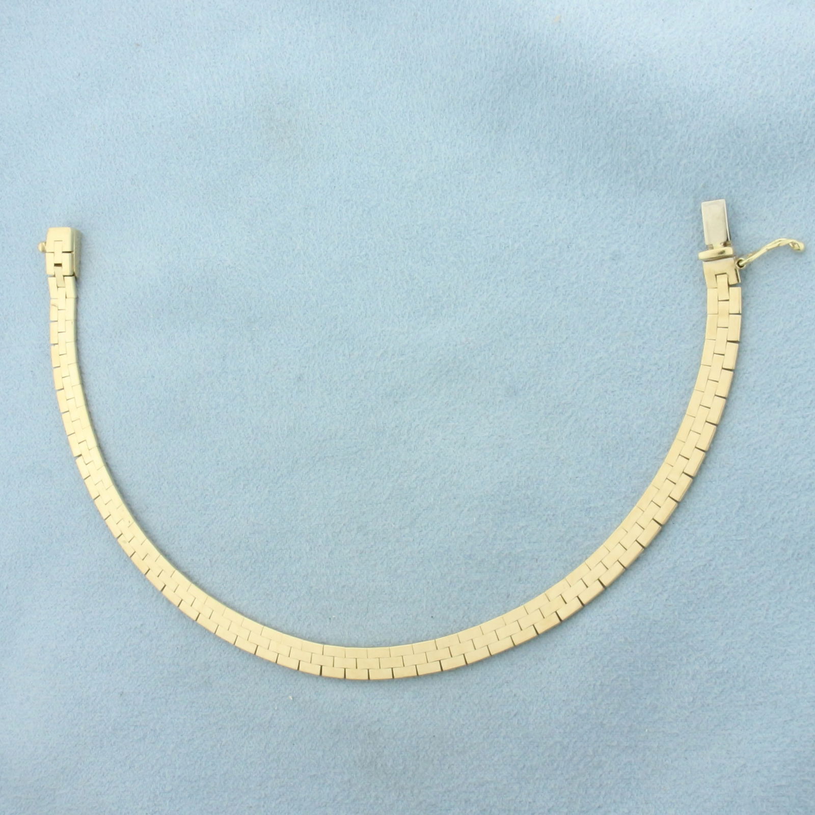 Italian Brick Link Bracelet in 14k Yellow Gold: In 14k Yellow Gold. 7 3/8 inches long. 4.7mm wide. Italian made. Slide closure with safety latch. 11.4g.