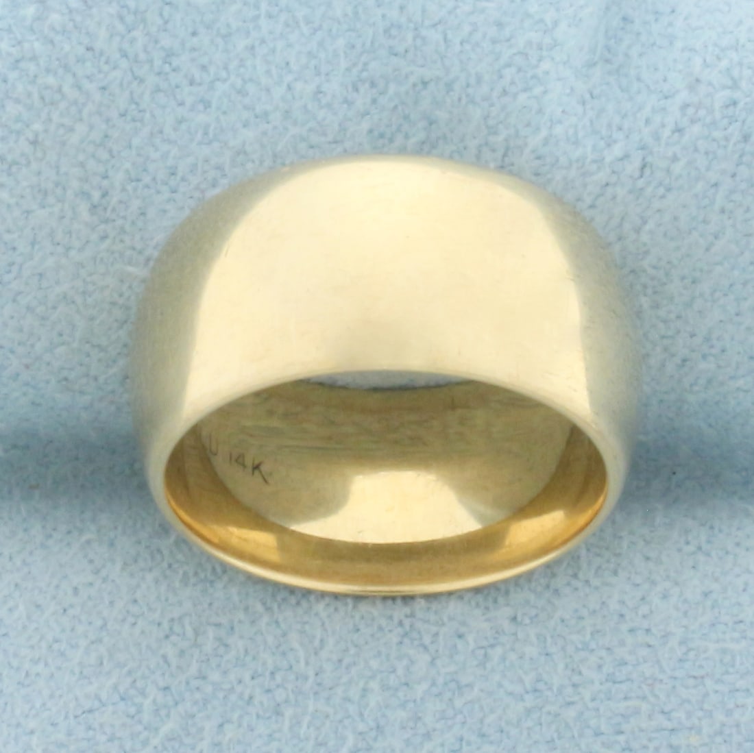 Wide Cigar Band Ring in 14k Yellow Gold: In 14k Yellow Gold. 9mm wide. High polish. Size 4.75. 7.8g.