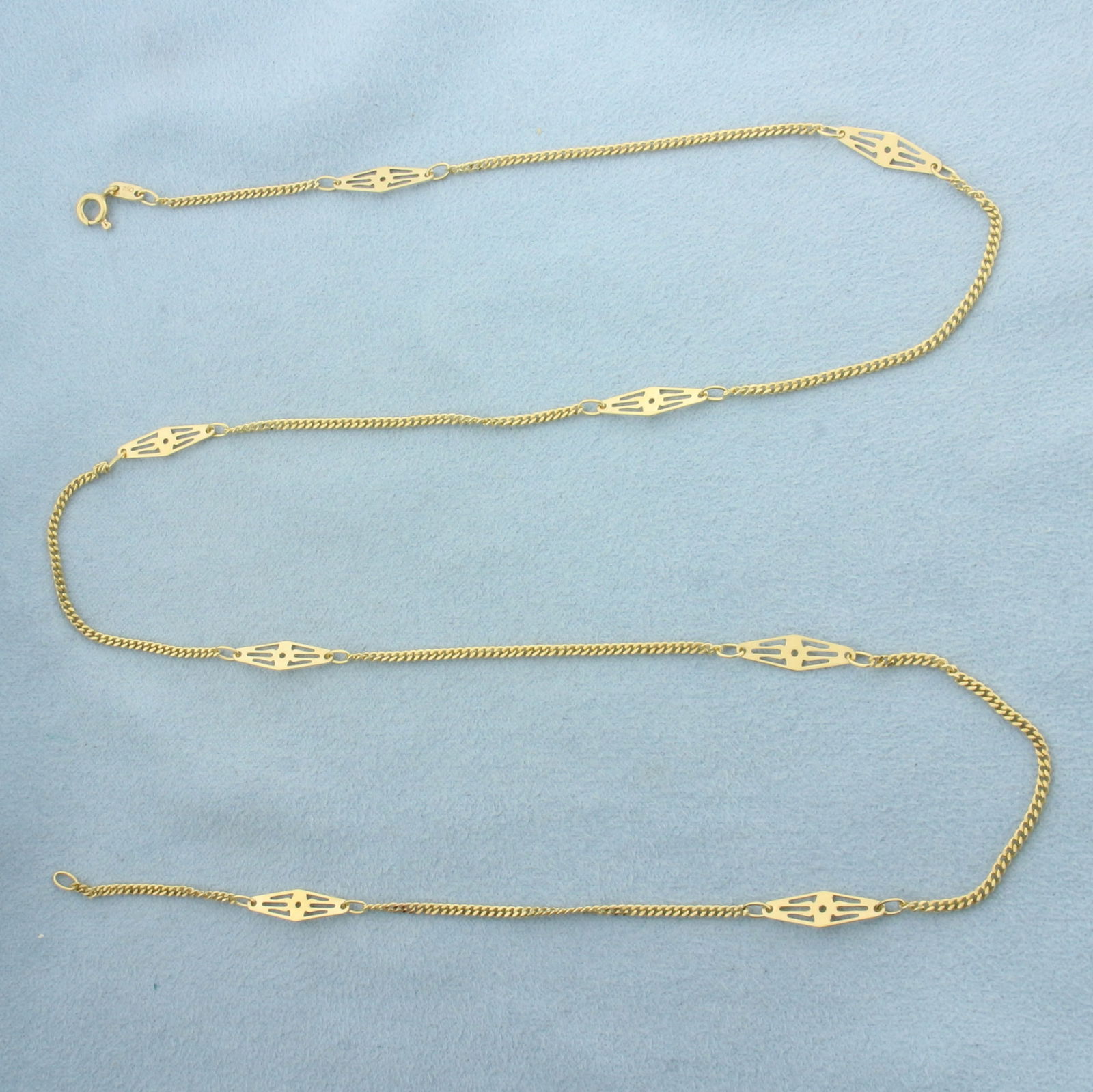 24 Inch Italian Curb Link Station Chain Necklace in 18k Yellow Gold: In 18k Yellow Gold. 24 inches long. 4.4mm wide at center of station pieces. Italian made. Spring clasp. 6.1g.