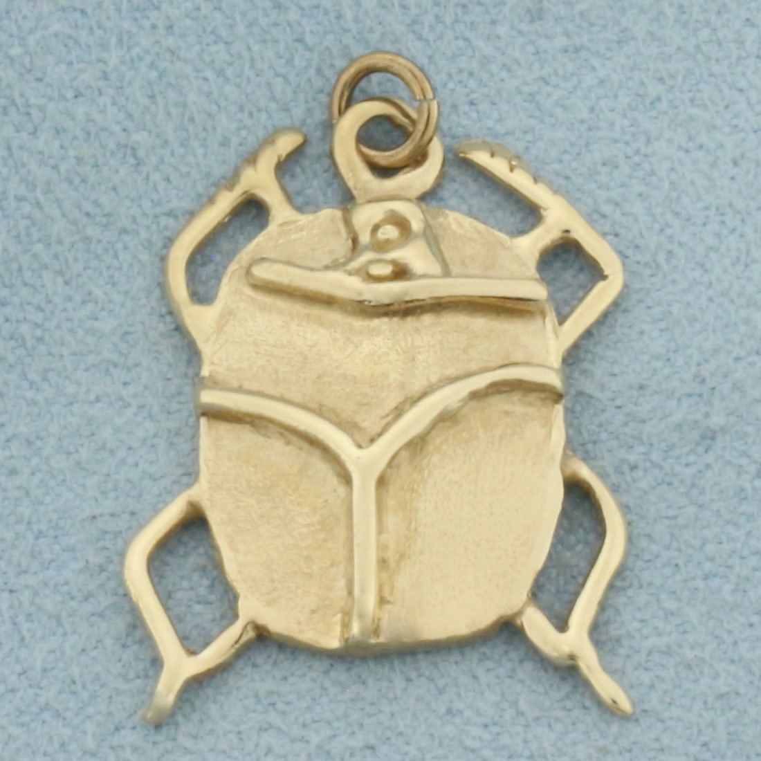 Beetle Scarab Charm or Pendant in 14k Yellow Gold: In 14k Yellow Gold. 1 inch long. 5/8 inch wide. 3.7g.