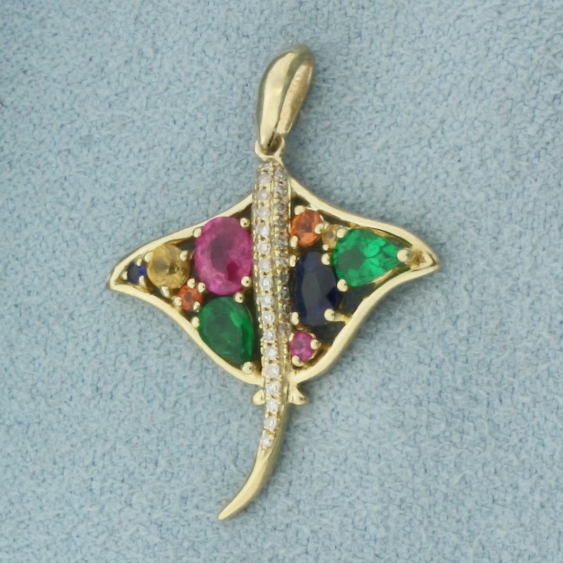 Effy Watercolors Sapphire and Diamond Stingray Pendant in 14k Yellow Gold: In 14k Yellow Gold. Contains ten high quality natural multi-color Sapphire gemstones, .81ct TW, with vibrant color. Also contains thirty-seven high quality diamonds, 1/10ct TW. 1 inch long. 3/4 inch w
