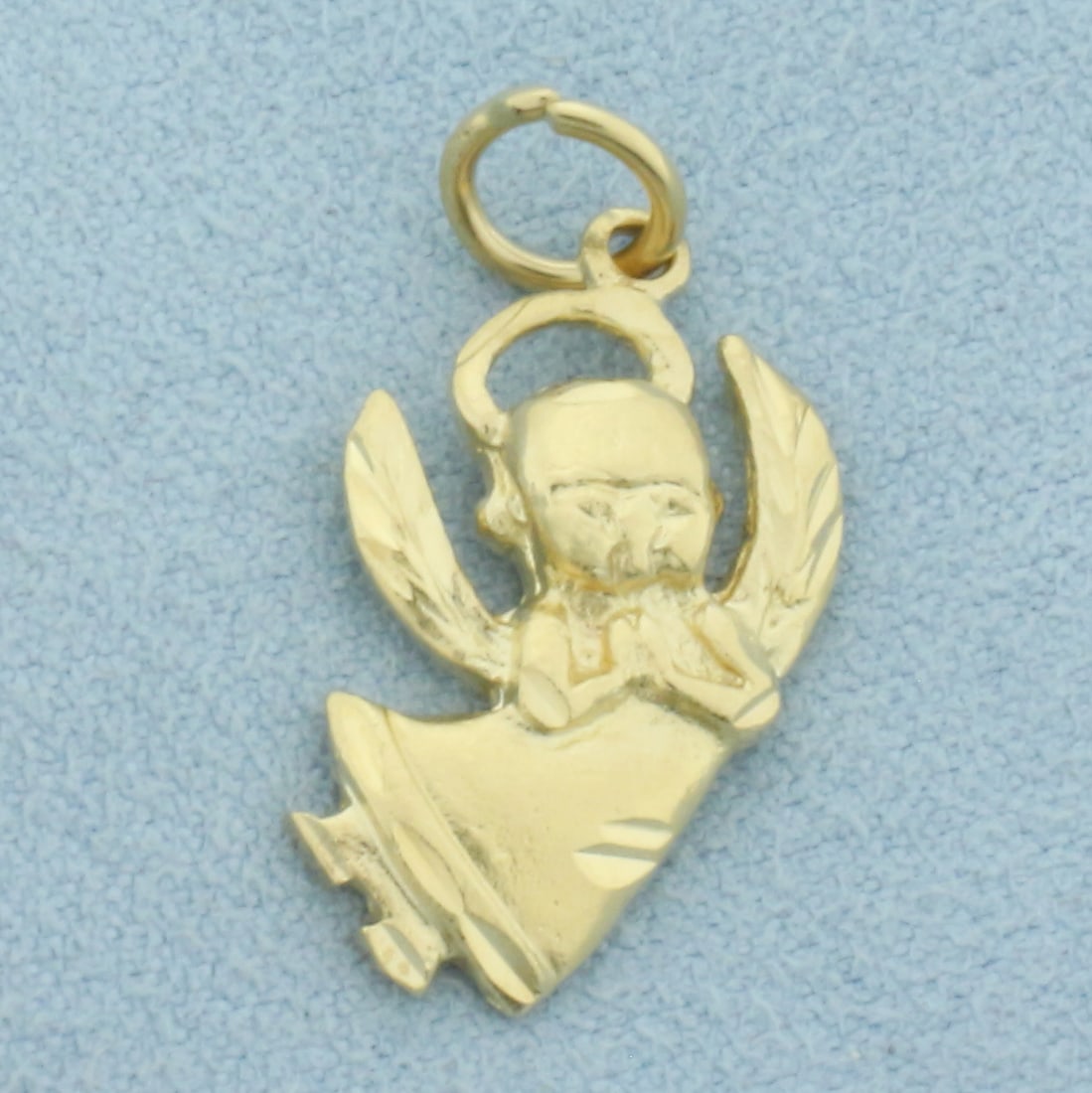 Angel Charm or Pendant in 14k Yellow Gold: In 14k Yellow Gold. 1 inch long (including jump ring). 1/2 inch wide. 2.4g.