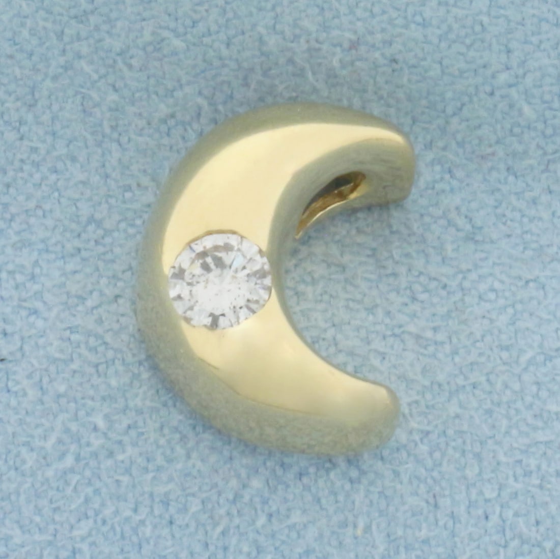 Diamond Moon Pendant in 14k Yellow Gold: In 14k Yellow Gold. Contains one 1/4ct high quality diamond, H color/I clarity. 1/2 inch long. 3/8 inch wide. 2.4g.