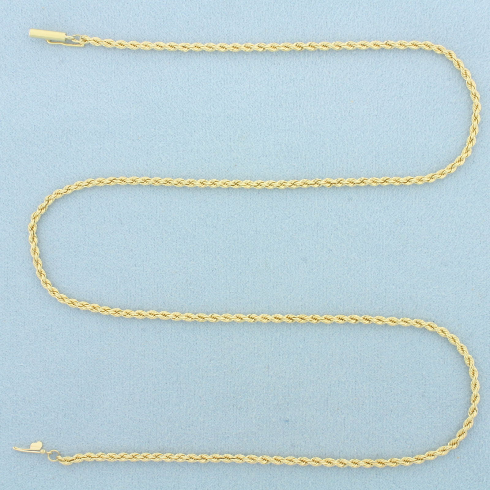 18 Inch Rope Link Chain Necklace in 18k Yellow Gold: In 18k Yellow Gold. 18 inches long. 2.1mm wide. Barrel clasp with safety latch. 8.9g.