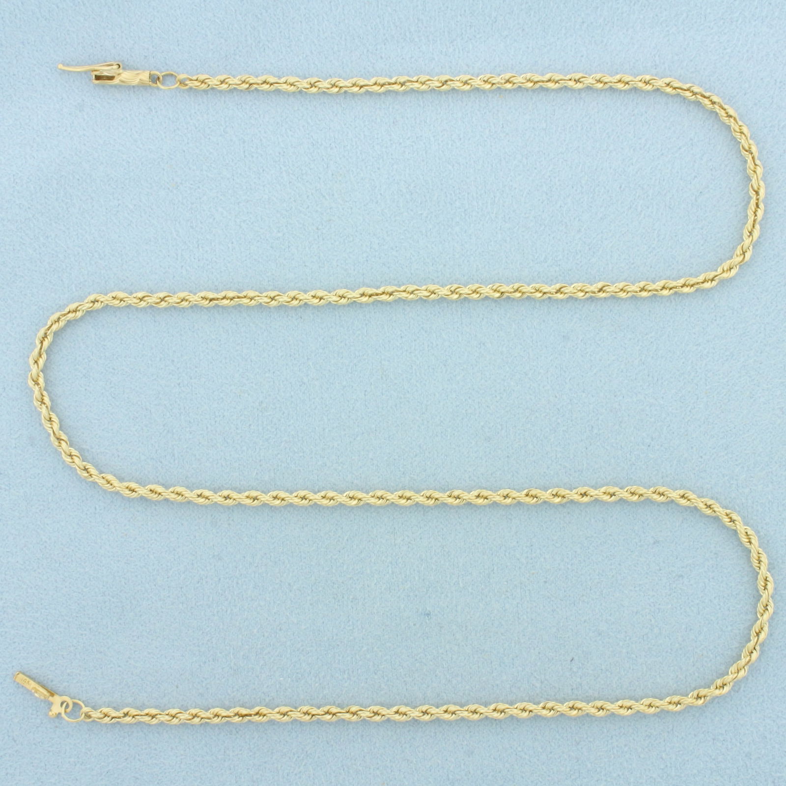 18 Inch Rope Link Chain Necklace in 14k Yellow Gold: In 14k Yellow Gold. 18 inches long. 2.3mm wide. Barrel clasp with safety latch. 9.4g.