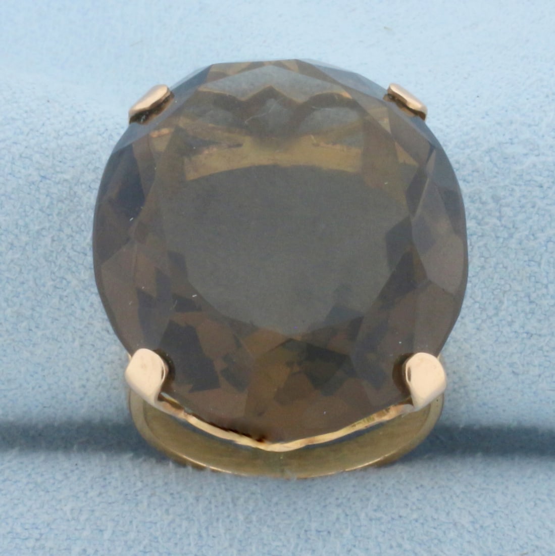 50ct Smoky Topaz Statement Ring in 18K Yellow Gold: In 18K Yellow Gold. Contains a high quality natural 27mm x 21mm oval Smoky Topaz gemstone with warm color and excellent clarity. Size 5. 13.6g.