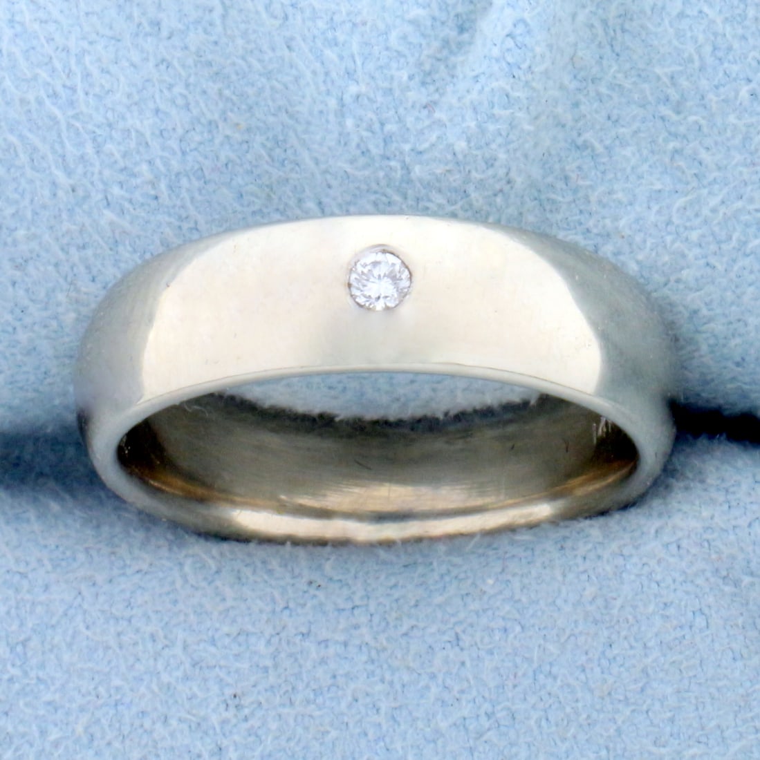 Solitaire Diamond Band Ring in 14K White Gold: In 14K White Gold. Contains one high quality .07ct diamond, VS clarity/G color. 6.1mm wide, size 8 1/4. 8.8g.