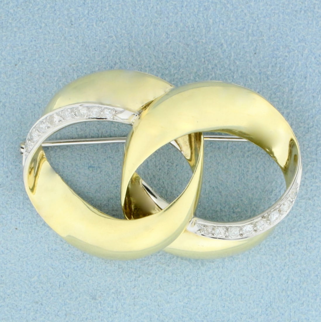 Vintage Diamond Double Circle Pin in 14K Yellow Gold: In 14K Yellow Gold. Contains sixteen high quality diamonds, 1/3ct TW, SI clarity/H color. 1 3/4 inches long, 1 inch wide. 8.4g.