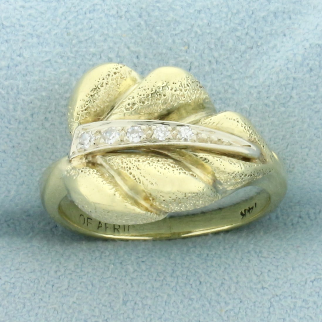 Diamond Leaf Ring in 14K Yellow and White Gold: In 14K Yellow and White Gold. Contains five high quality 1/2pt Diamonds. Engraved "Of Africa" inside of shank. Textured finish for unique look. Size 6. 6.0g.