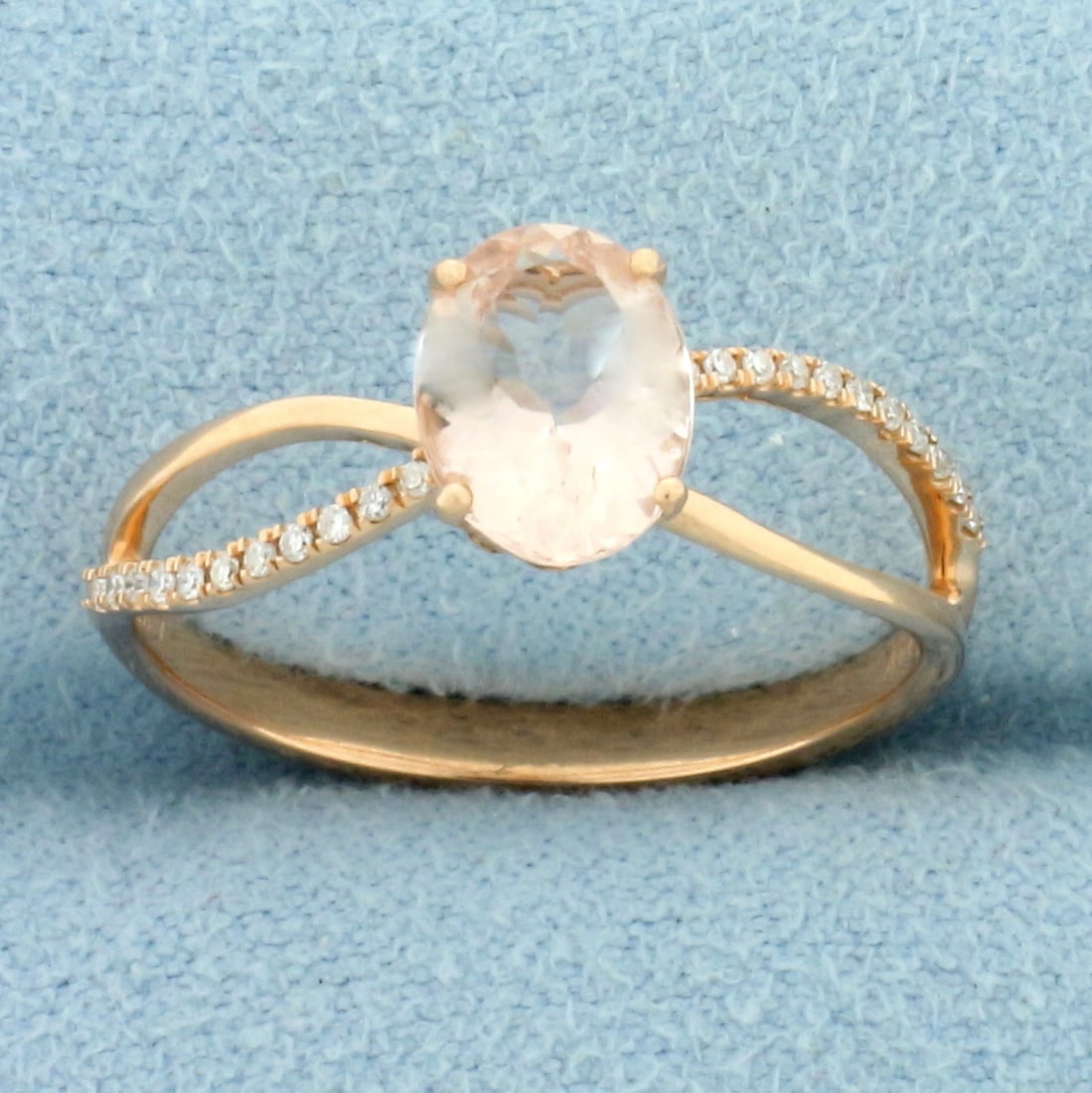 Designer Morganite and Diamond Ring in 14k Rose Gold: In 14k rose gold. Contains one high quality natural 1.5ct Morganite gemstone with beautiful salmon color and excellent clarity. Also contains twenty two high quality 1/2pt diamonds. Size 7. 2.2g.