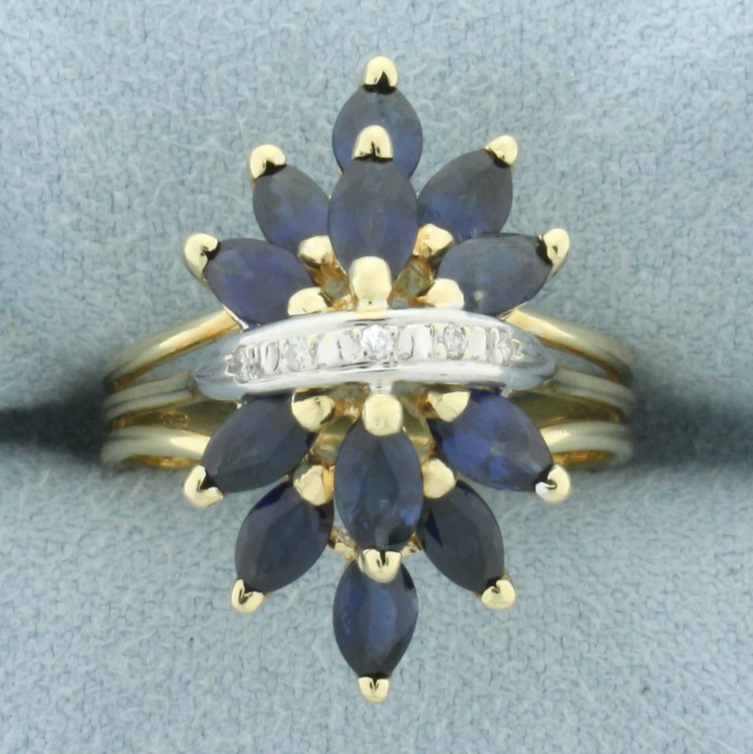 Sapphire and Diamond Spray Design Ring in 14k Yellow Gold: In 14k yellow gold. Contains 12 high quality natural marquise cut sapphires, 1.5ct TW, with vibrant color and excellent clarity. Accepted by 5 high quality 1/2pt diamonds. Size: 6. 4.6g.