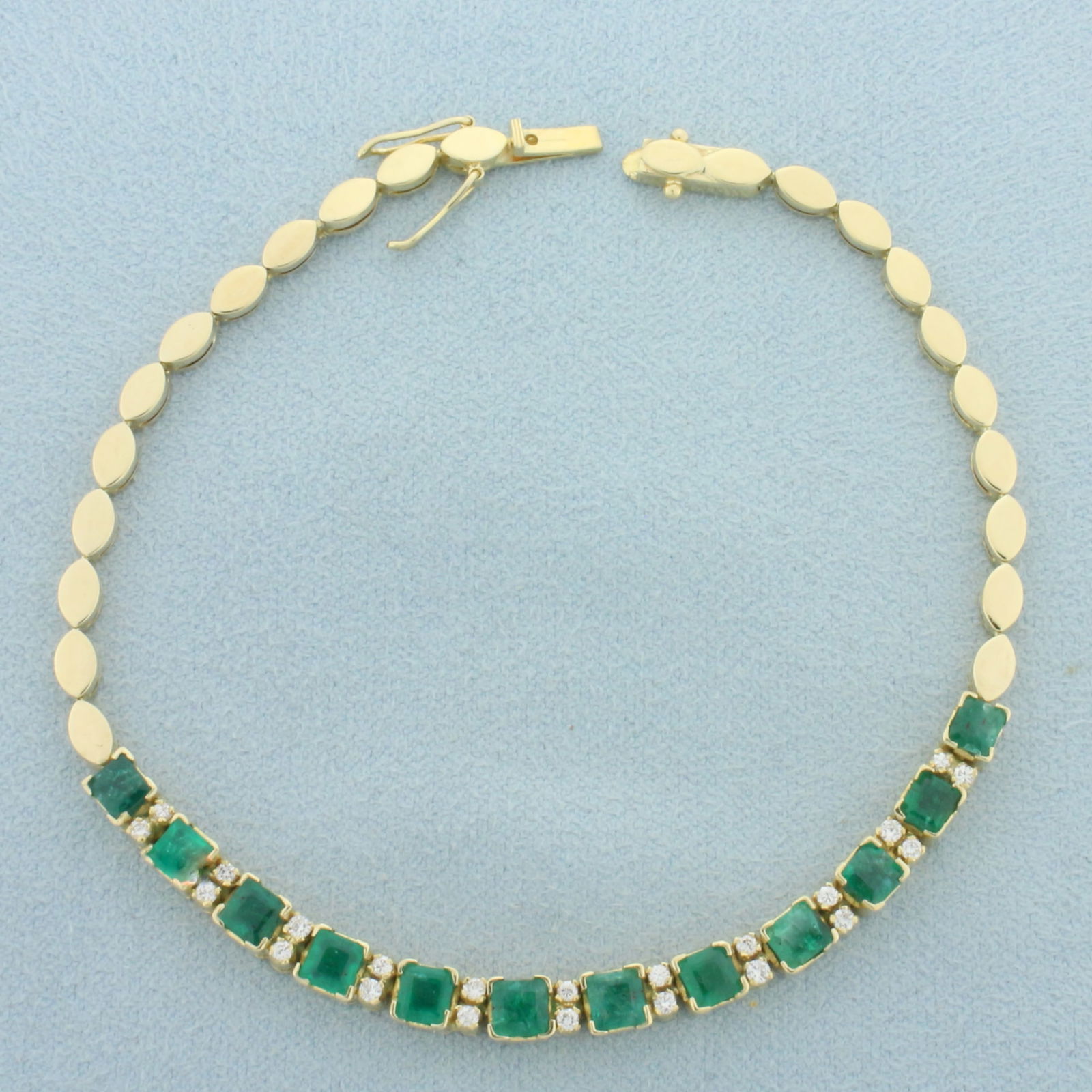 Natural Emerald and Diamond Bracelet in 18k Yellow Gold: In 18k yellow gold. Contains twelve high quality natural untreated 3.8mm square cut emeralds with intense green color. Also contains twenty two high quality .01ct round brilliant diamonds, VS clarity/