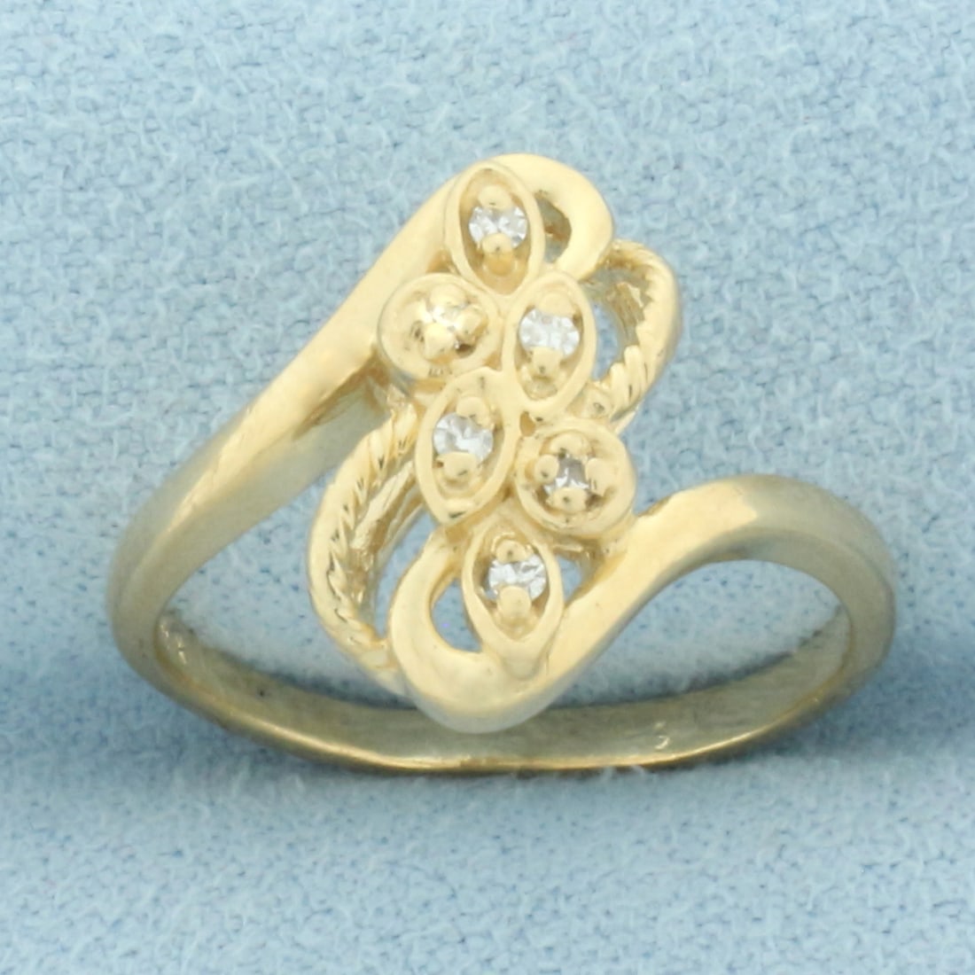 Diamond Leaf Nature Design Ring in 14k Yellow Gold: In 14k yellow gold. Contains six high quality .01ct diamonds, VS clarity/H color. 14.2mm wide at center. Size: 6.5. 3.1g.