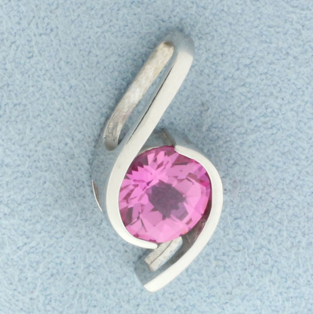 2ct Checkerboard Cut Pink Sapphire Pendant in 14k White Gold: In 14k white gold. Contains one high quality 8mm 2ct Pink Sapphire gemstone with intense color and excellent clarity . 7/8 inches long and 3/8 inches wide. 2.5g.
