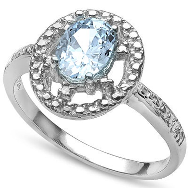 Aquamarine and Diamond Ring in Sterling Silver: In platinum over .925 sterling silver. Contains one aquamarine gemstone, 0.77cts, with light aqua color. Accented with 2 genuine diamonds, .01ctw. Size 6. 2.6g.
