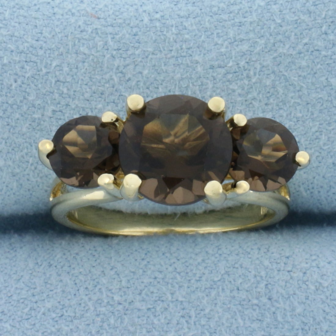 Brazilian Smoky Quartz 3-Stone Ring in 14k Yellow Gold.: In 14k Yellow Gold. Contains one 9mm and two 6mm high quality natural Brazilian Smoky Quartz gemstones, 3.39ct TW, with intense color and excellent clarity. Certificate of authenticity included. Size