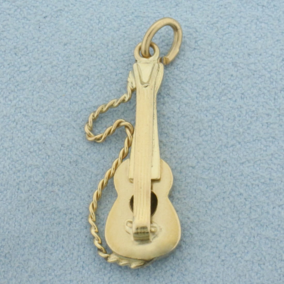 Guitar Charm or Pendant in 14k Yellow Gold: In 14k Yellow Gold. 1 inch long. 7/16 inch wide at widest. 2.3g.