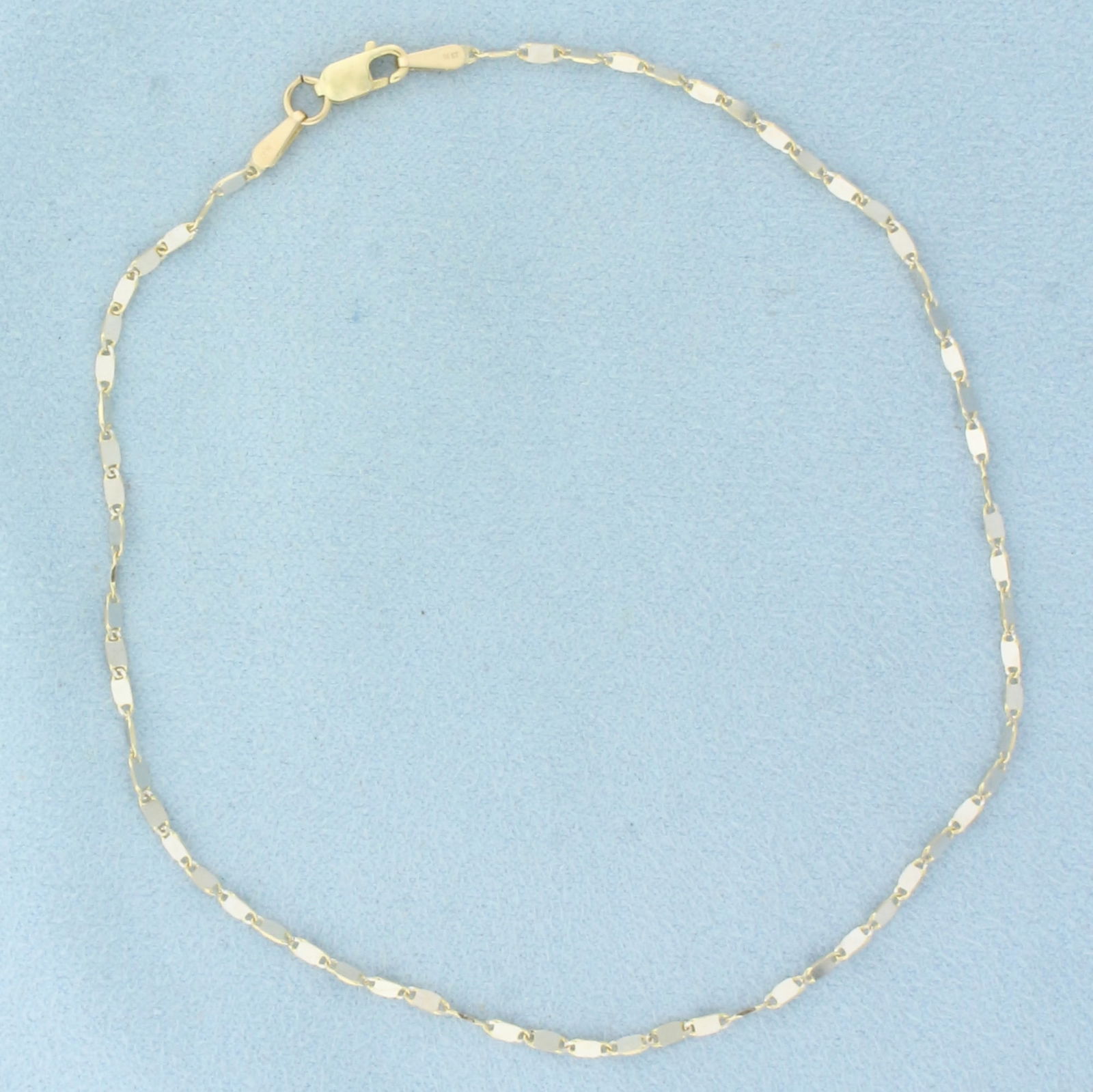 Sparkle Link Anklet in 14k Yellow Gold: In 14k Yellow Gold. 10 1/8 inch long. 1.6mm wide. High polish design for sparkle. Lobster clasp. 2.1g.