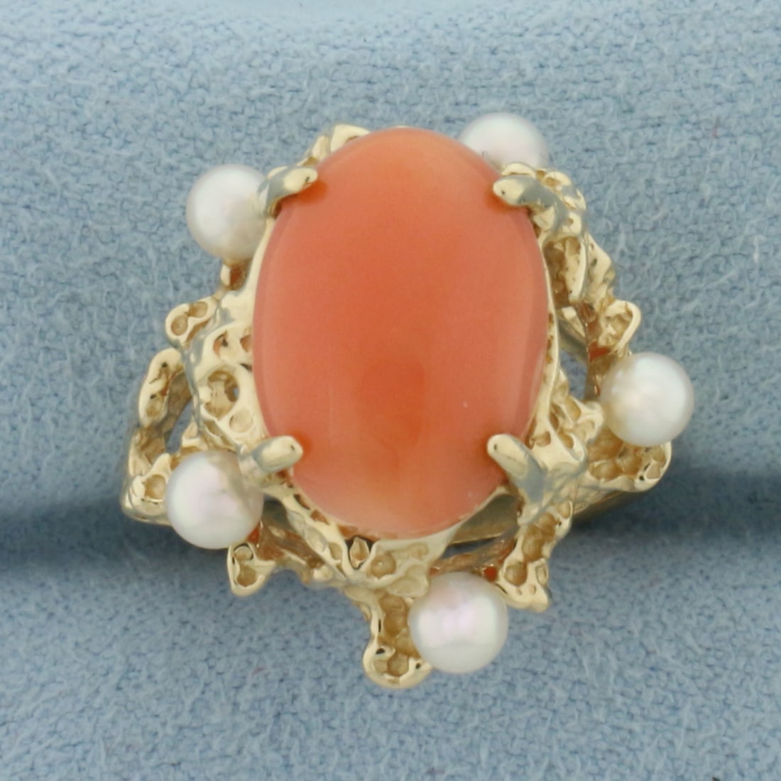 Pink Angel Coral and Pearl Ring in 14k Yellow Gold: In 14k Yellow Gold. Contains one 14mmx10mm high quality Angel Pink Coral gemstone with intense color. Also contains five 3.3mm high quality cultured akoya pearls with high luster. Size 7. 7.3g.