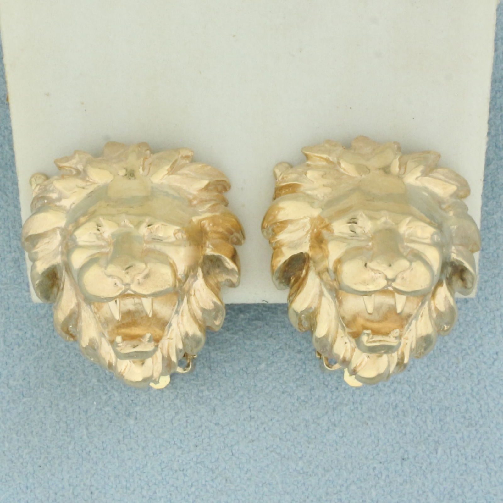 Lion Omega Back Earrings in 14k Yellow Gold: In 14k Yellow Gold. 3/4 inch long. 3/4 inch wide. For Pierced ears. 16.3g.