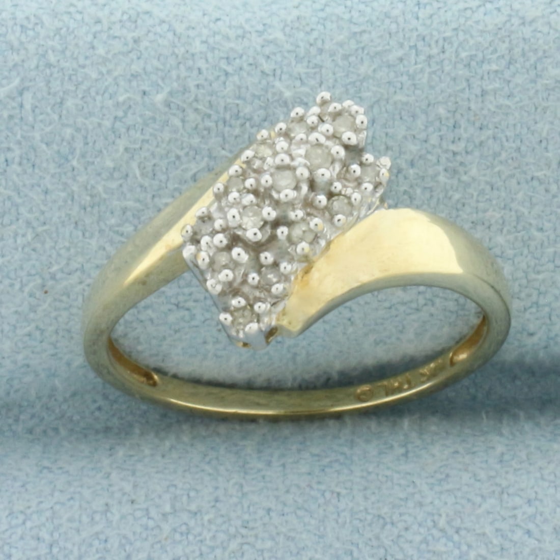Diamond Cocktail Bypass Ring in 10k Yellow Gold: In 10k Yellow Gold. Contains fifteen high quality 1/2pt diamonds. 11.5mm wide at widest spread. Size 7. 2.1g.