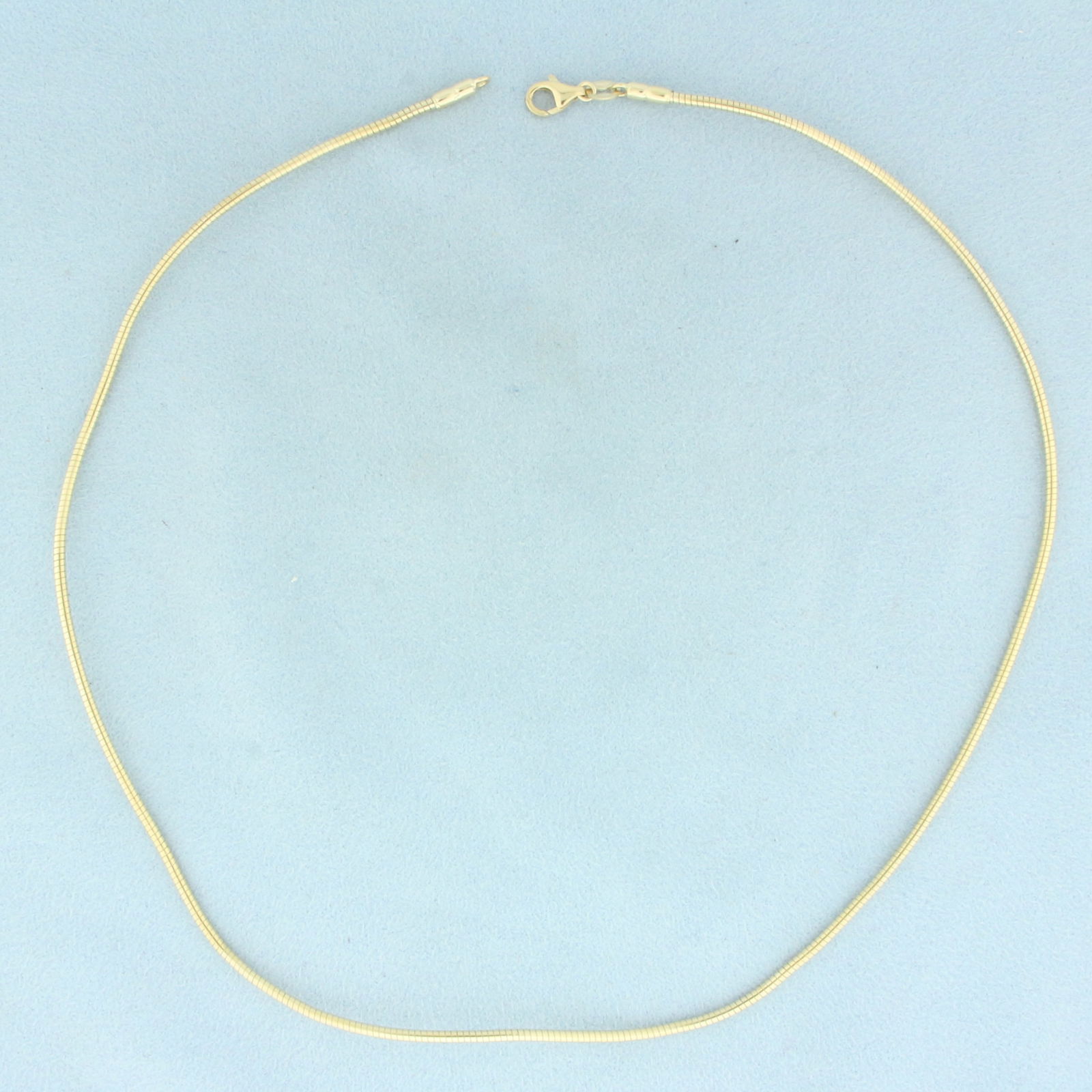 Italian 17 Inch Snake Link Chain Necklace in 14k Yellow Gold: In 14k Yellow Gold. 17 inches long. 1.6mm wide. Italian made. Lobster clasp. 9.6g.