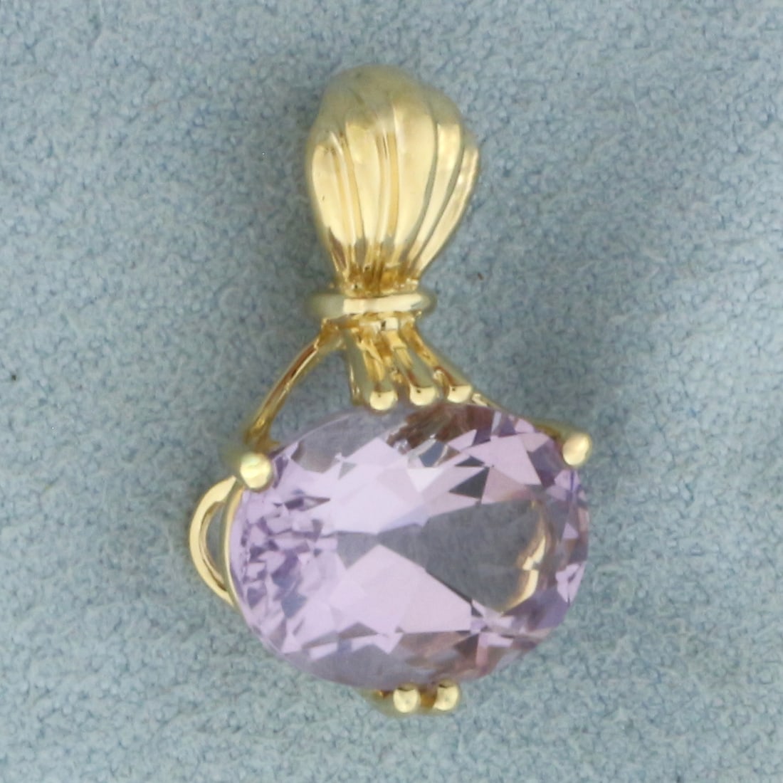 Purple Tourmaline Pendant in 14k Yellow Gold: In 14k Yellow Gold. Contains one 14x11mm high quality oval cut natural Tourmaline gemstone, approximately 6cts, with beautiful purple color and excellent clarity. 7/8 inch long. 1/2 inch wide. 2.9g.