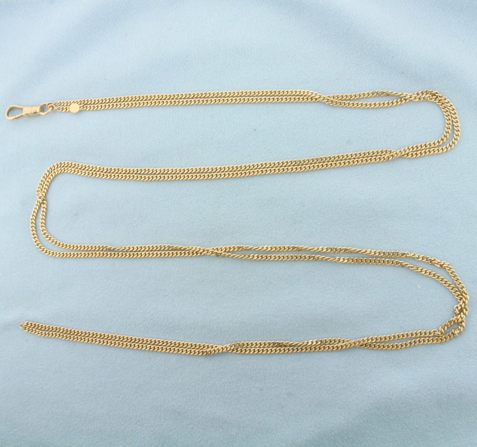 Antique 1917 Curb Link Pocket Watch Chain with Dog Clip in 14k Yellow Gold: In 14k Yellow Gold. 29 inches long. 2.4mm wide chain. Made by Peikes (Freed and Peikes from New York). 29.6g.