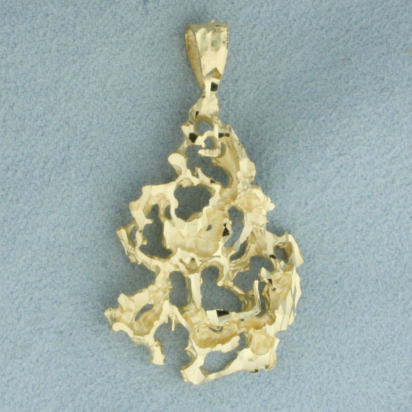 Freeform Nugget Gold Pendant in 14k Yellow Gold: In 14k Yellow Gold. 1.5 inches long. 7/8 inch wide. 4.9g.
