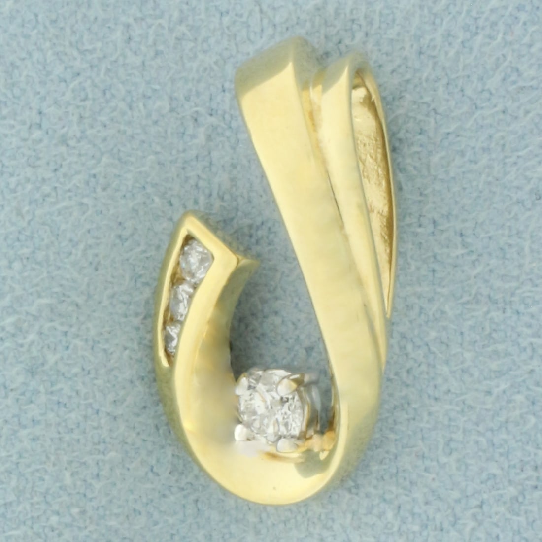 Diamond Pendant or Slide in 14k Yellow Gold: In 14k Yellow Gold. Contains one .15ct, one .05ct, one .03ct, and one .02ct high quality diamonds, .25ct TW, G color/I clarity. 3/4 inch long. 1/2 inch wide. 2.6g.