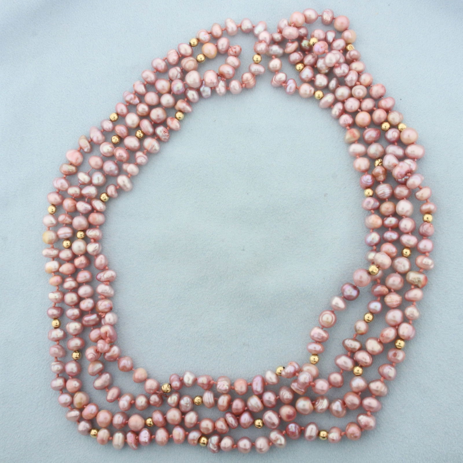 Baroque Pink Pearl and Gold Ball Bead Double Strand Necklace: Contains 7-8mm high quality pink baroque pearls with high luster. 4mm gold ball beads. Longer strand 40 inches long. Hand knotted. 88.3g.