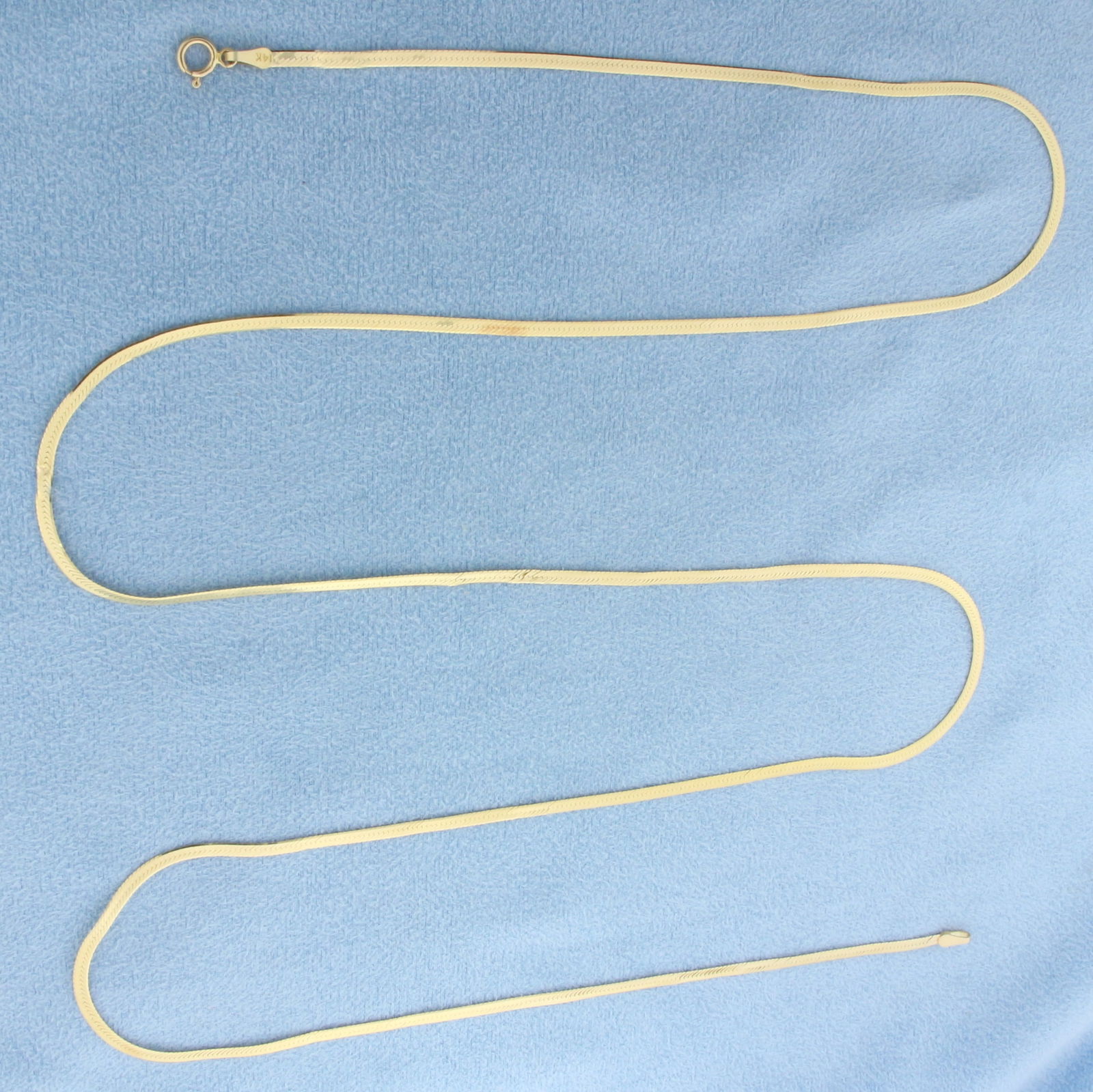 30 Inch Herringbone Link Chain Necklace in 14k Yellow Gold: In 14k Yellow Gold. 30 inches long. 2mm wide. Minor bends in chain, not noticeable. Spring clasp. 4.2g.