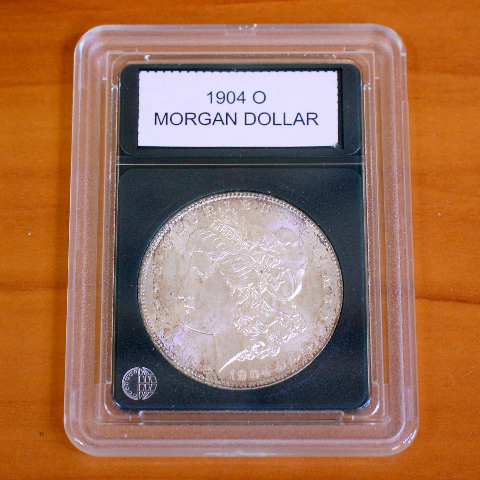 Morgan Silver Dollar Coin in Slab: One coin from 1878-1921. Packaged by CoinWorld. Very Fine Condition. Picture of a sample coin, will get one in similar condition.