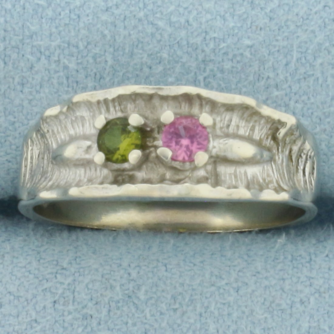 Pink Topaz and Peridot Ring in 14k White Gold: In 14k White Gold. Contains one 3mm high quality natural Pink Topaz and Peridot gemstones, with intense color and excellent clarity. 7.3mm wide. Size 8.5. 3.9g.